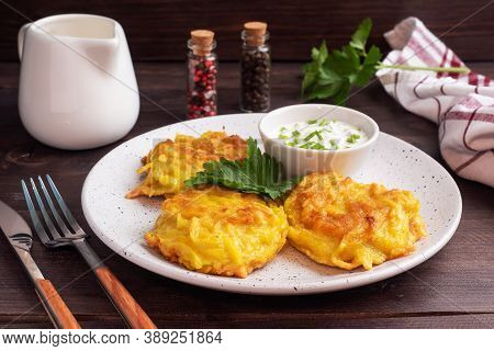 Fried Cakes Of Grated Potatoes On The Plate With Sauce. Traditional Pancakes Boxty Raggmunk.