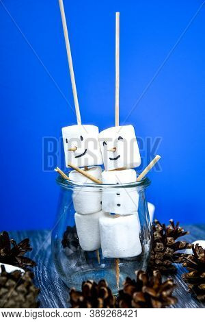 Two Happy Funny Marshmallow Snowmen. Marshmallow Friends On Blue Background. Diy. Sweet Treat For Ki