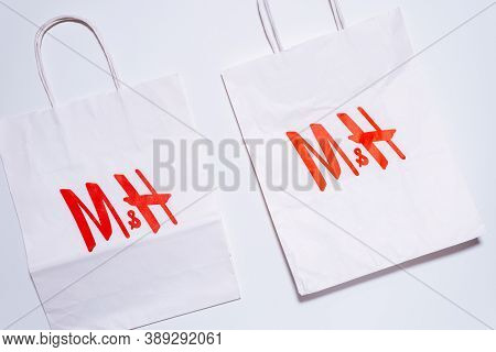 Tyumen, Russia-august 01, 2020: H And M Logo On A White Package Top View. H And M Hennes Mauritz Ab 
