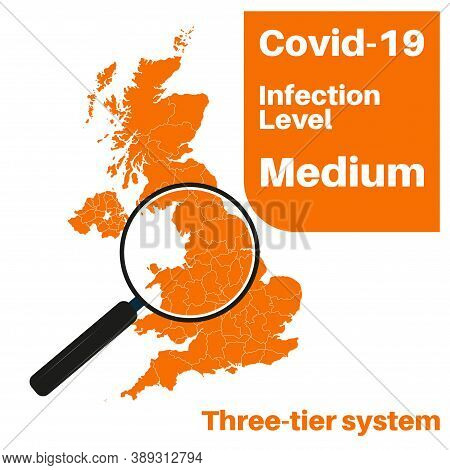 Covid-19 Uk Infection Level Medium With Map And Magnifying Glass.