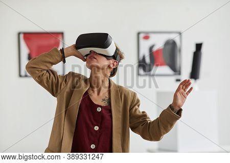 Graphic Waist Up Portrait Of Modern Young Woman Wearing Vr Gear While Enjoying Immersive Experience 