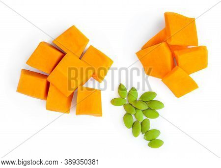 Pumpkin Pieces Cut In A Cube Slices Isolated On White Background. Diced Pumpkin, Close Up. Top View