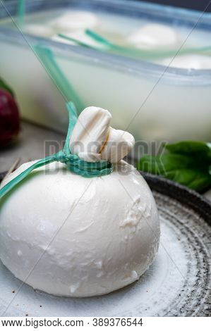 Eating Of Fresh Handmade Soft Italian Cheese From Puglia, White Balls Of Burrata Or Burratina Cheese