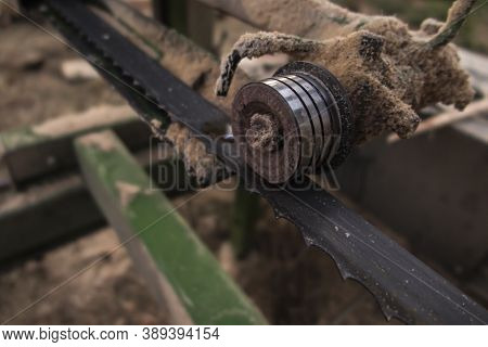Fragment Of Mobile Sawing Equipment For Logs In The Open Air. Rural Landscape On A Sunny Day. Mobili