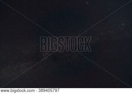 black night sky and stars as background, the milky way and falling Perseid meteors