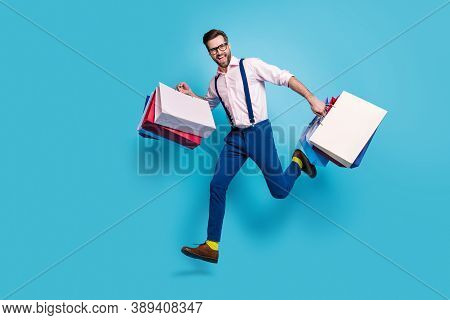 Full Length Profile Photo Of Handsome Business Man Carry Bags Jump High Buy Vacation Stuff Shopping 