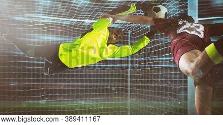 Soccer Goalkeeper, In Fluorescent Uniform, Makes A Save On A Close Head Shot Of The Attacker