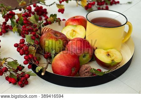 Cozy Autumn Hot Tea With Honey, Apples And Red Hawthorn Berries On A Tray. Still Life On White Backg