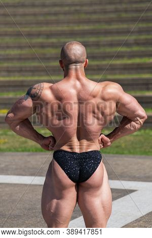 Powerful Muscular Bodybuilder In Panties Posing At The Park.  Quadriceps Contraction