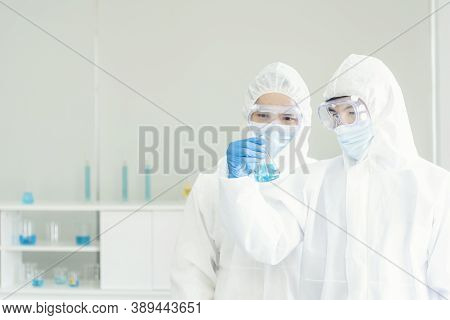 Two Asian Scientist Team Reserch Chemistry Science Tube Experiment Biotech Antibody Sample In Labora