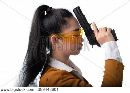 Portrait Beautiful Asia Woman Wearing A Yellow Suit One Hand Holding A Pistol Gun At The White Backg