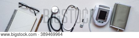Stethoscope, Tonometer, Thermometer And Doctors Notebook On White Background. Concept Of First Need 