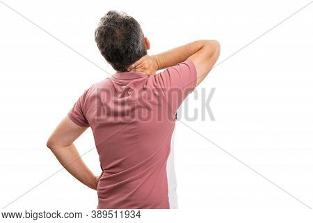 Adult Male Model In Summer Attire Having Muscle Pain Strained Touching Neck With Back To Camera Copy