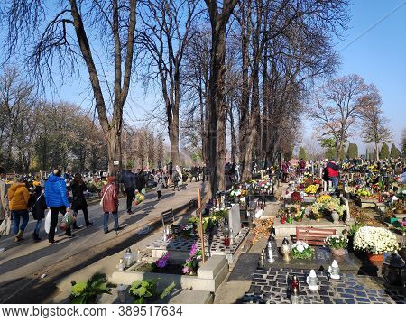 Bytom, Poland - November 1, 2019: People Visit Cemetery During All Saints Day In Bytom. All Saints D