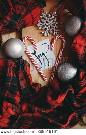 Cards, sticks and panel clothes on wooden tables for Christmas celebrations
