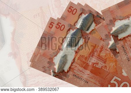 50 Canadian Dollars Bills Lies In Stack On Background Of Big Semi-transparent Banknote. Abstract Pre