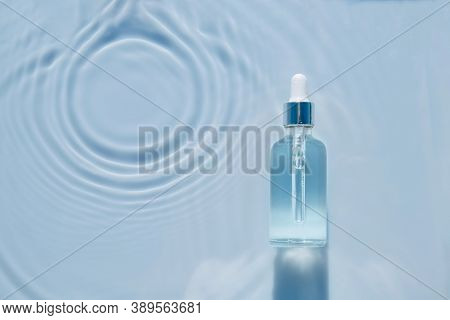 Cosmetic Spa Medical Skin Care, Bottle For Serum, Micellar Toner And Emulsion On Water Texture Backg