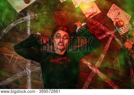 A portrait of a scary witch in the wooden house. Magic, dark force, spell. 