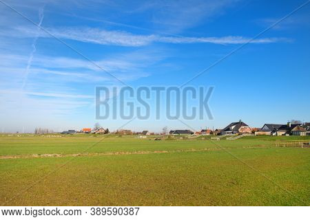 Typical Dutch landscape in Polder at village Eemdijk