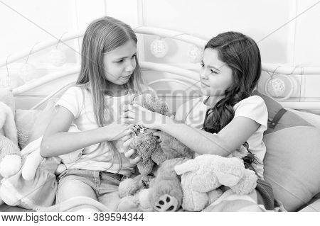 Generosity And Greediness. Teach Sister Sharing Toys. Greedy Sisters. Kids Play Toys In Bed. Little 