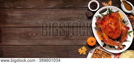 Traditional Thanksgiving Turkey Dinner. Overhead View Side Border On A Dark Wood Banner Background W