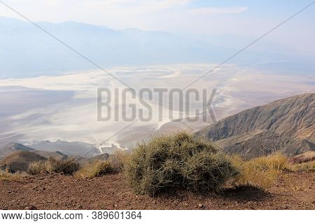 Mountain Ridge Overlooking Badwater Dry Lakebed Covered With Salt From Natural Evaporation Taken Fro