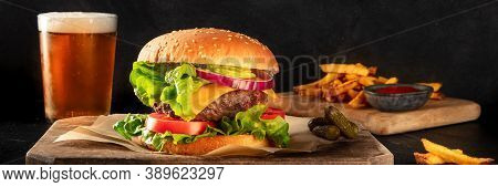 Burger And Beer Panorama. Hamburger With Beef, Cheese, Onion, Tomato, And Green Salad, With Pickles 