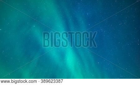 Aurora Borealis Background Over The Sky Of Iceland