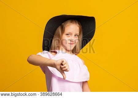 Dislike Gesture. Skeptik Child. Wrong Choice. Bad Idea. Dissatisfied Little Girl In Summer Outfit Re