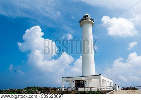 Cape Zanpa Lighthouse With Blue Sky Bright Clouds