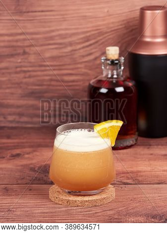 Amaretto sour: a cocktail made with amaretto liqueur, lemon juice, simple syrup and egg white, and topped with a cherry and orange