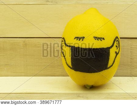 Background And Masked Lemon Concept. Lemon In A Protective And Medical Mask As A Conceptual Idea Of 