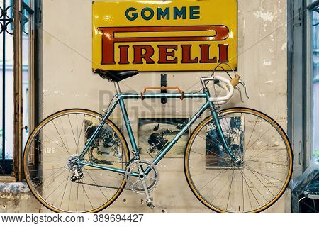 Logo Pirelli On The Wall, Bicycle In Bicycle Store. Pirelli Is An Italian Multinational Company, Foc