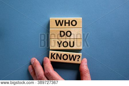 Male Hand Placing A Block With Word 'know' On A Blocks Tower With Words 'who Do You Know'. Beautiful
