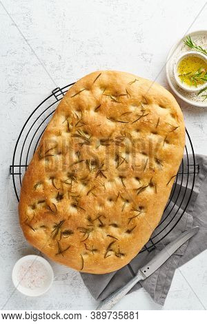 Focaccia, Pizza, Italian Flat Bread With Rosemary And Olive Oil On Grid