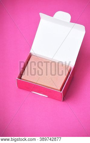 Natural Organic Eco Handmade Pink Soap In Pink And White Recycled Paper Box On A Pastel Pink Backgro