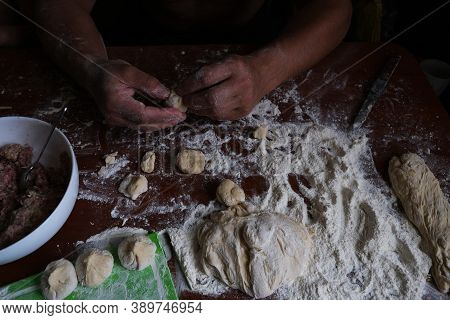 Male Strong Hands Sculpt Dumplings. A Delicious And National Dish Of Russia.