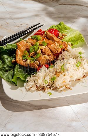 Japanese Chicken Teriyaki Lettuce Wrap Dinner With Rice Peanuts Peppers And Sliced Green Onion