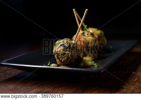 Delicious Swedish Meatballs With Sauce On Rustic Wooden Table