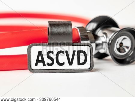 Ascvd Atherosclerotic Cardiovascular Disease Lettering On A Business Card With A Holder, Next To The