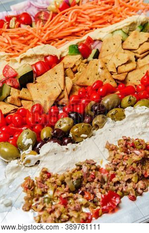 Greek Olive Hummus Platter With Sweety Drop Miniature Peppers And Pita Chips