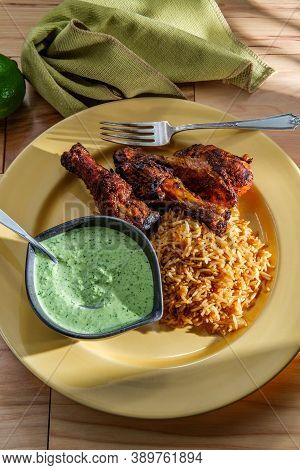 Peruvian Chicken Legs With Aji Verde Green Cilantro Sauce And Fried Rice