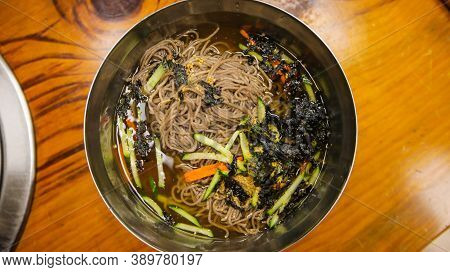 Top View Of Korean Summer Speciality Food, Cold Buckwheat Soba Noodles,memil Guksu, On A Stainless S