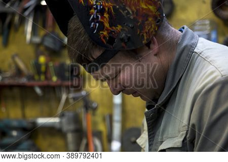 Close-up Portrait Of A Welder In The Workplace