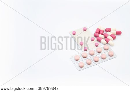 Medicine Pink Pills In Tablet And Capsul On White Background With Space For Text. Medicine For Heal