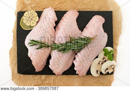 Raw Parts Of Turkey Wing, Three Pieces Of Chicken