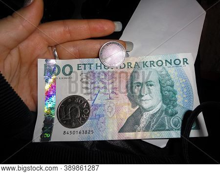 Swedish Currency Hundreds Of Notes And Coins. Dark Background.