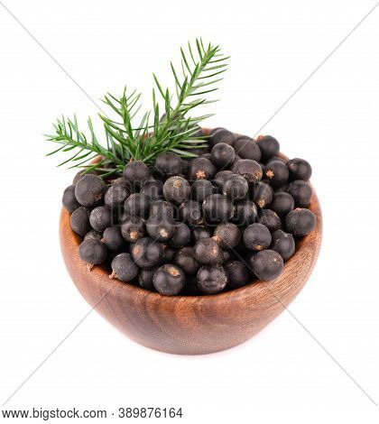 Dry Juniper Berries In Wooden Bowl, Isolated On White Background. Common Juniper Fruits.