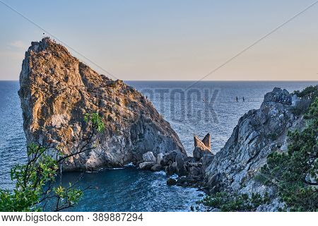 Coastal Seascape Landscape. Rock Diva, The Black Sea Coast Near Yalta, Crimea. People Walk On The Su