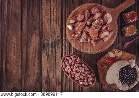 Ingredients For A Typical Brazilian Meal Feijoada - Top View With Space Copy